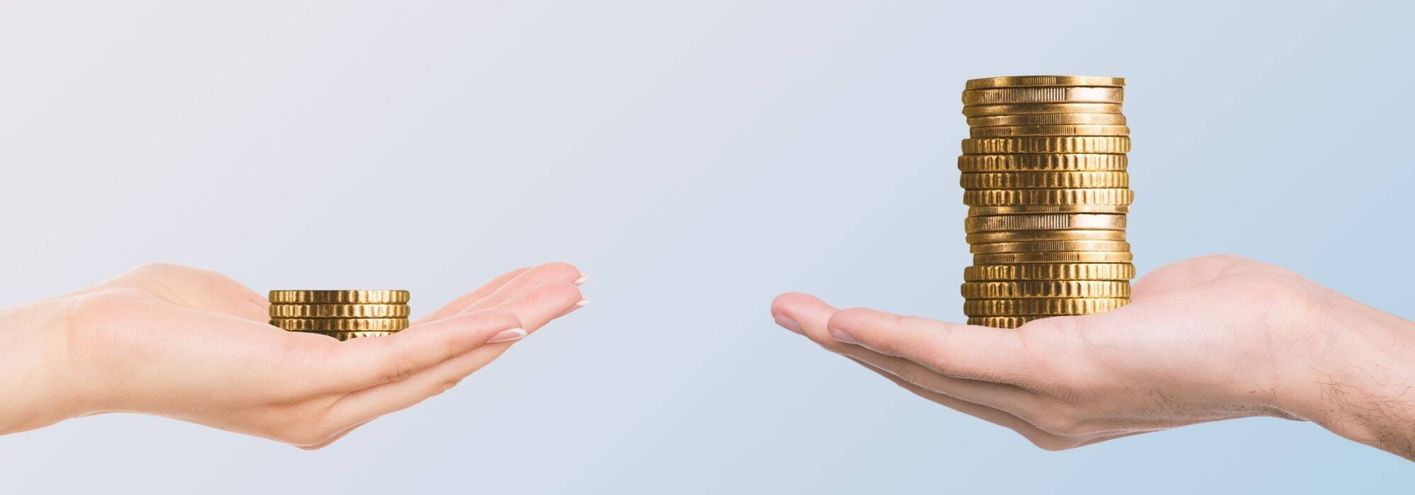 Two hands holding coins